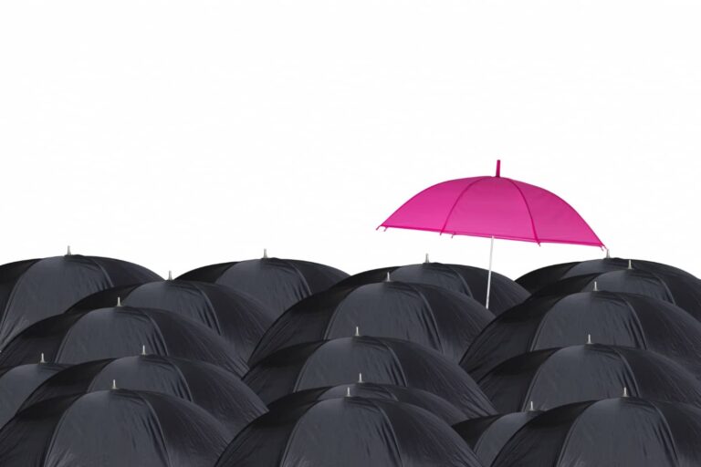 One pink Umbrella Among Black Umbrellas presented by SK Financial Services https://skfinancial.co