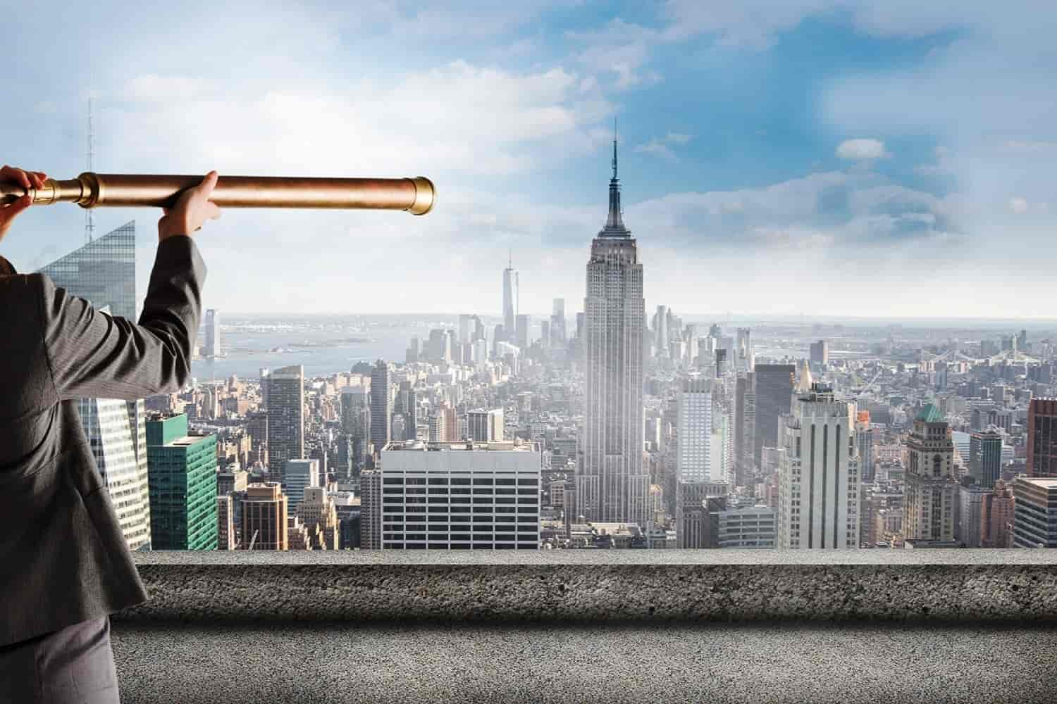 A man standing on building watching Empire Tower with binoculars Presented Vision of SK Financial Services https://skfinancial.co