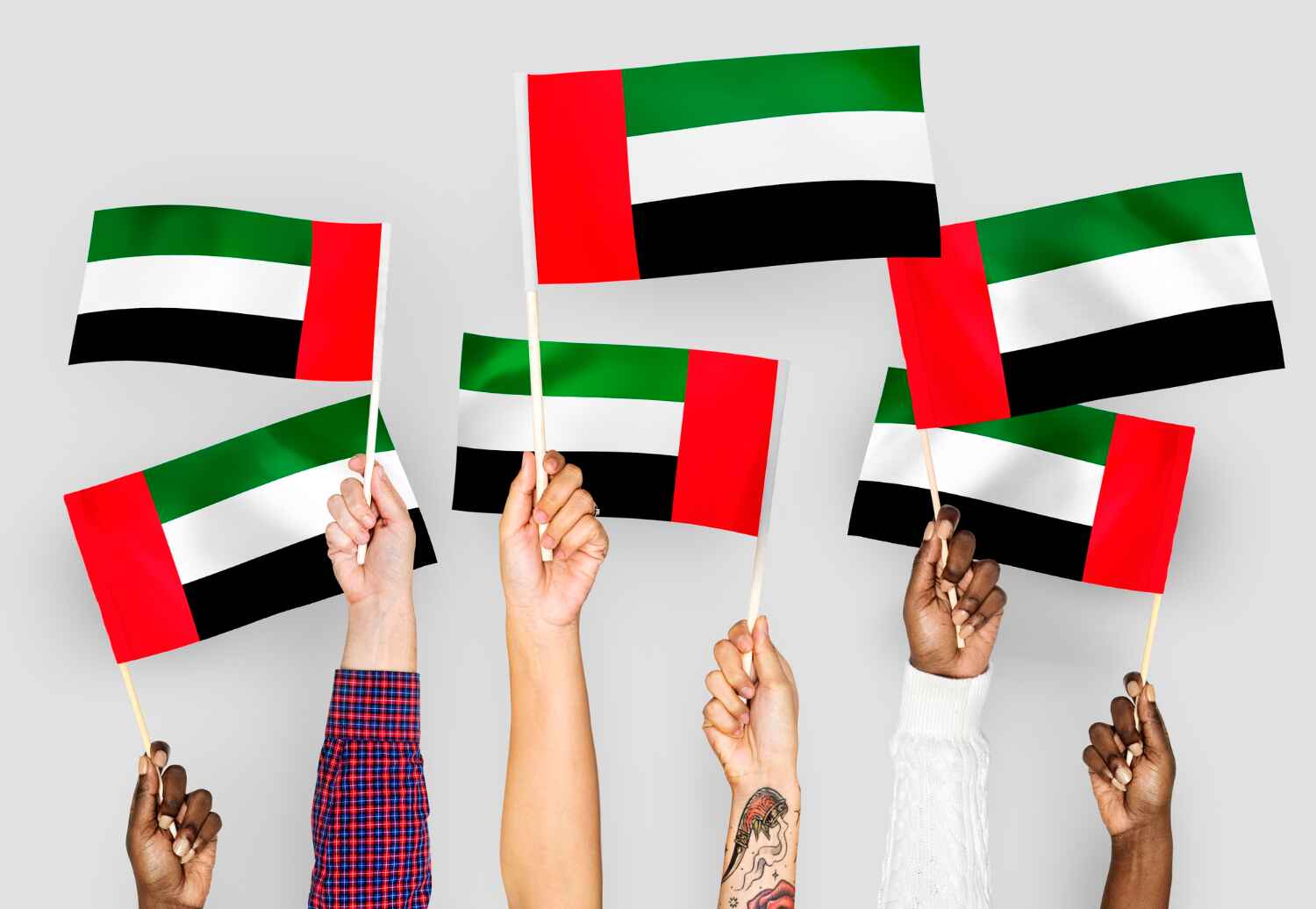 Different people waving UAE flag presented by SK Financial Services https://skfinancial.co