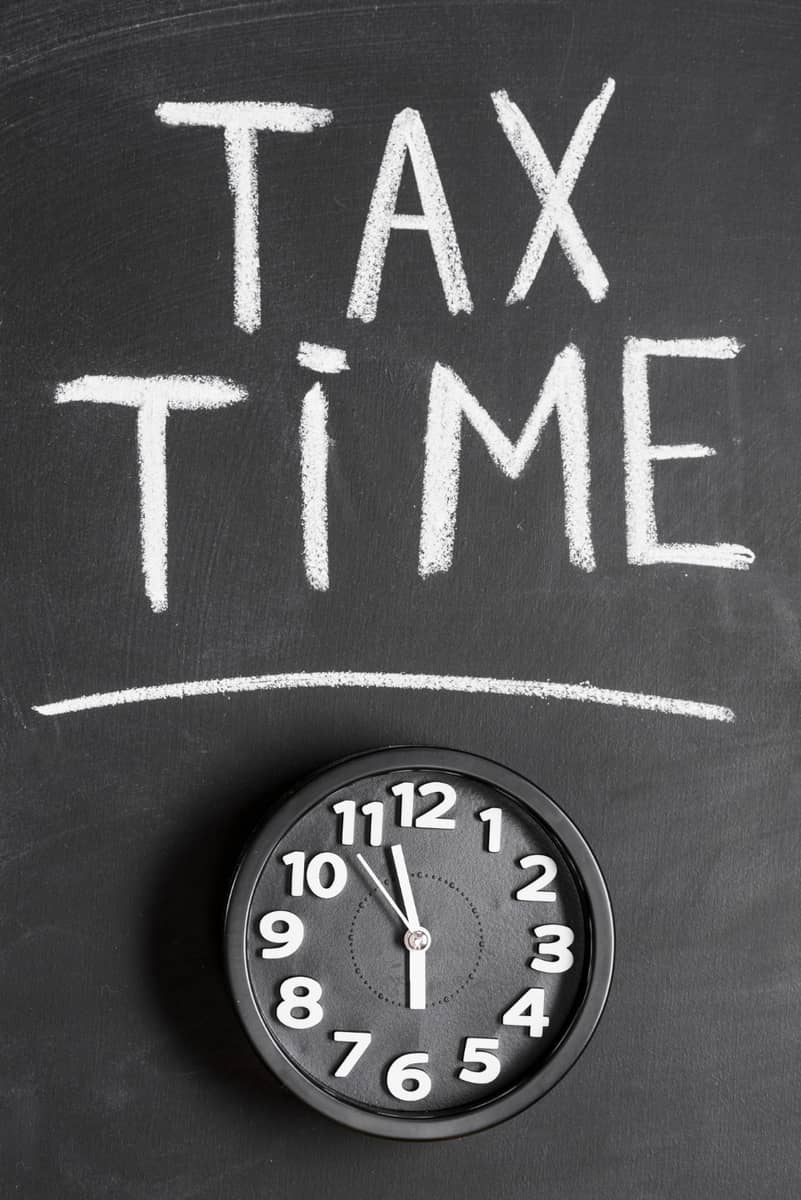 Tax Time with clock of Federal Tax Authority presented by SK Financial Services https://skfinancial.co