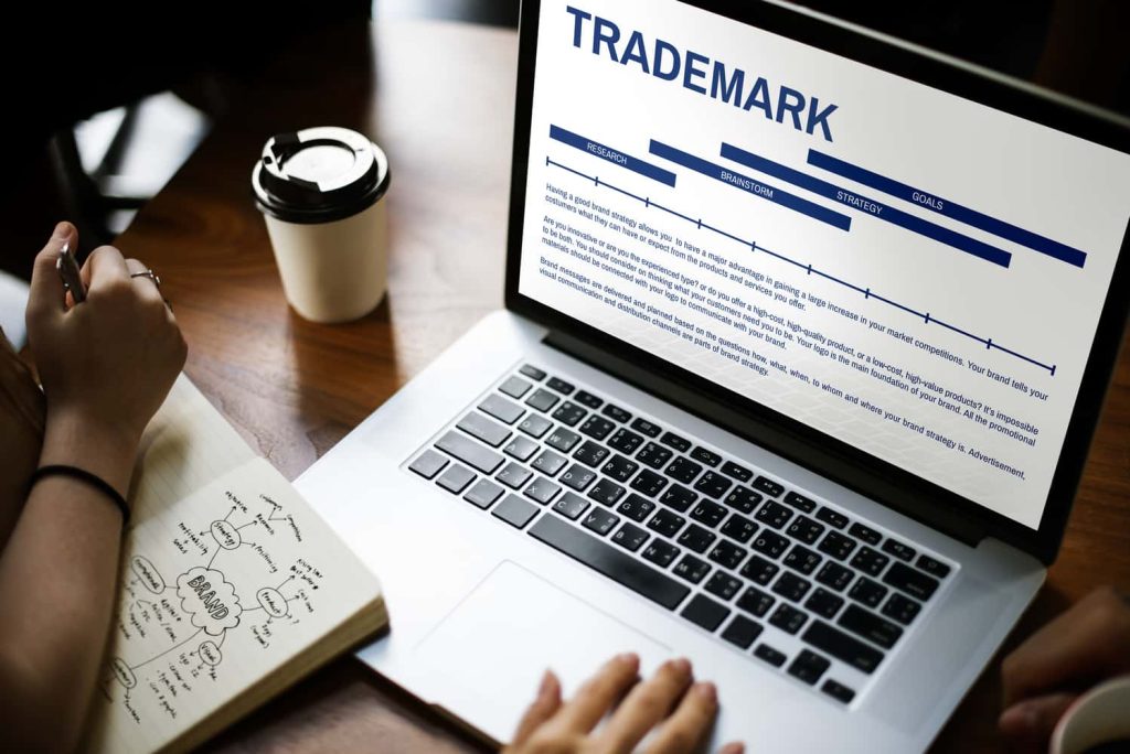 Trademark on laptop screen presented by SK Financial Services https://skfinancial.co