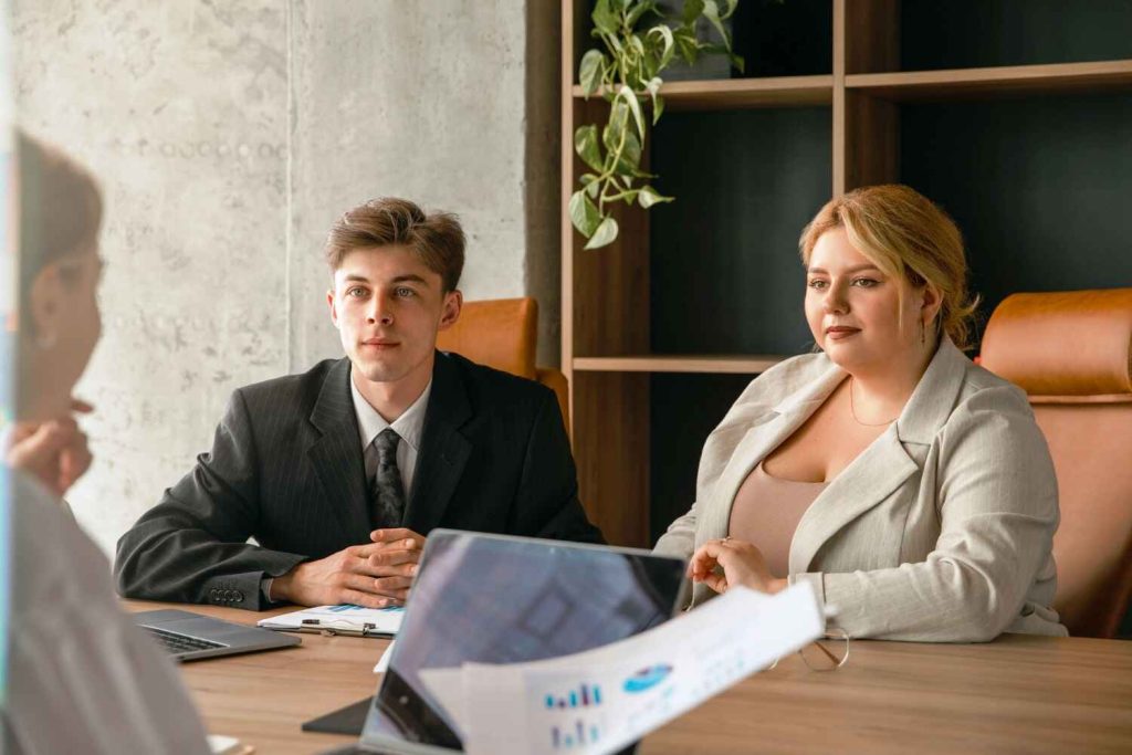 a woman is briefing to another lady and man, How Our Mediation Process Works presented by SK Financial Services https://skfinancial.co