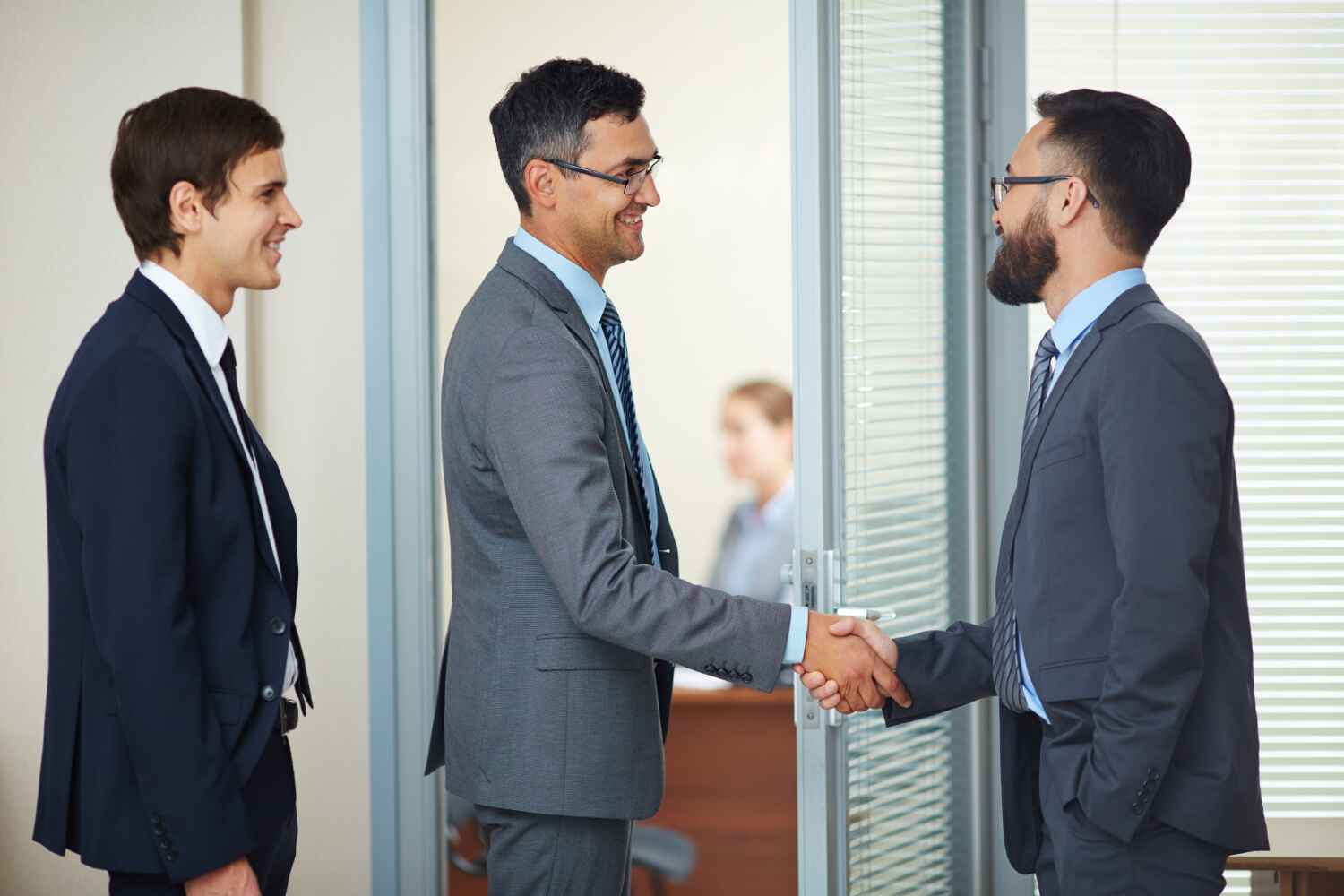 two men shaking hands and third man standing with them, Why Choose SK Financial Services for Financial Mediation presented by SK Financial Services https://skfinancial.co